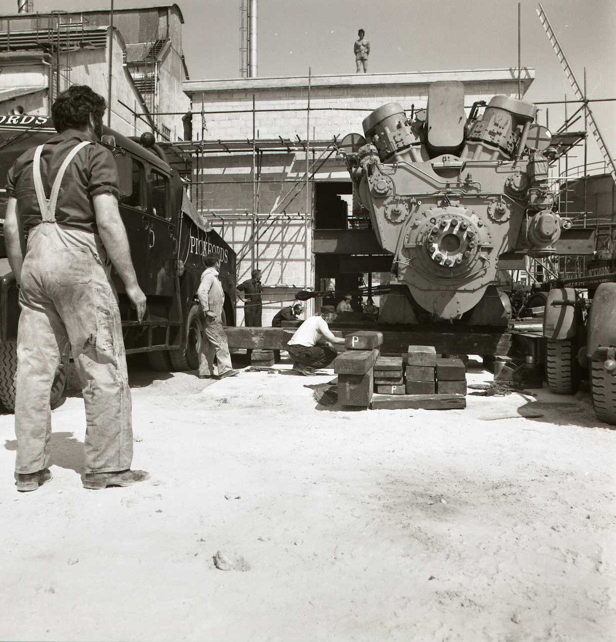 The alternator end manoeuvred into position in the clay-white yard.